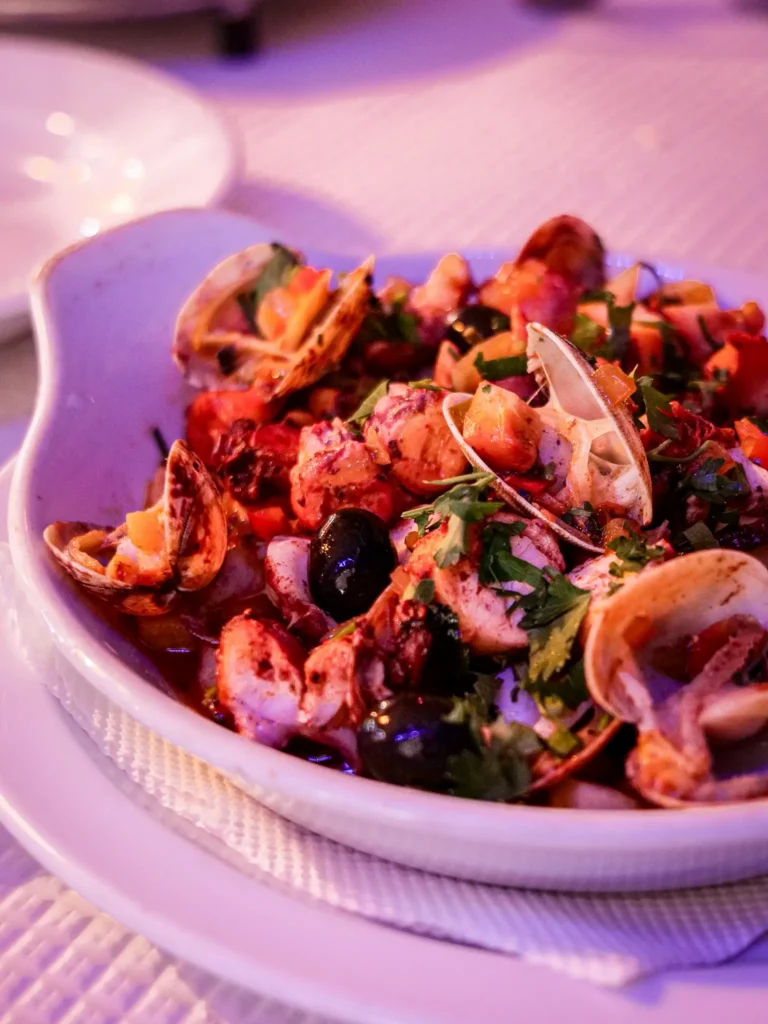Colorful seafood dish at the restaurant Polvo e Companhia, Santa Luzia, Algarve, Portugal.