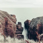 Red sandstone cliffs overlooking the North Sea near Arbroath, Scotland
