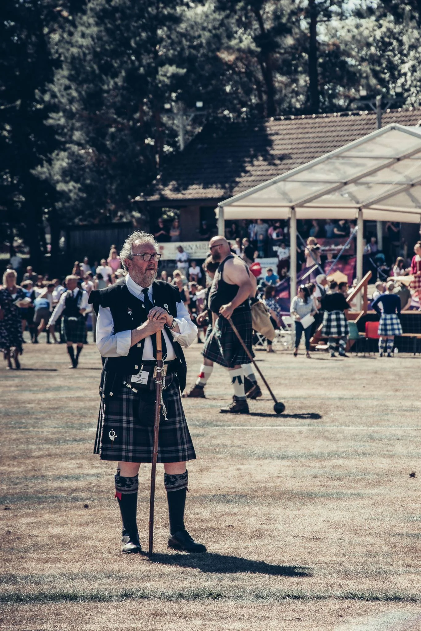 Old man in traditional Scottish kilt at the Highland Games field