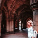 Caroline under the Gothic arches of the University of Glasgow
