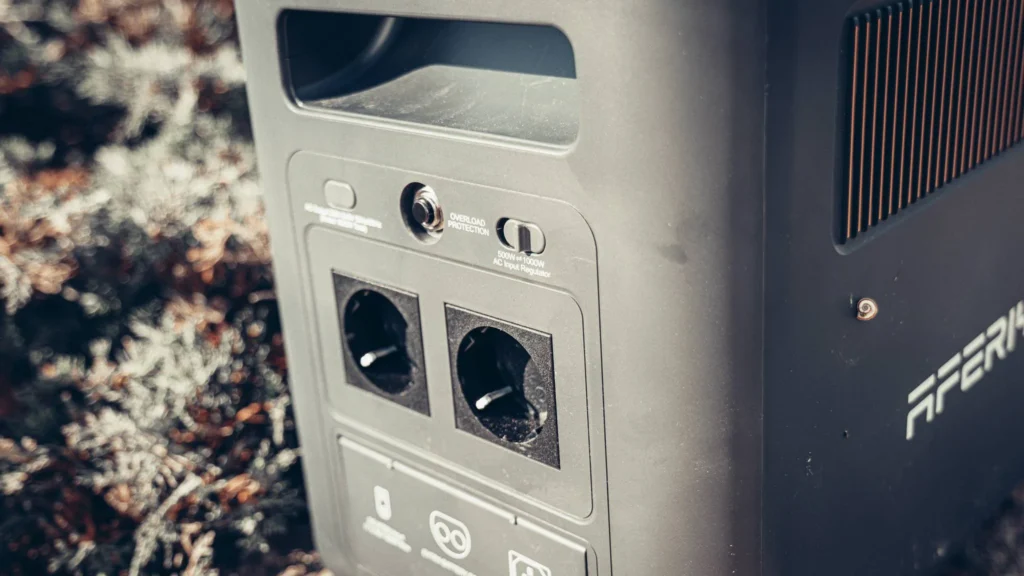 Back of the Aferiy Nomad 1800 with the 220V socket and the input charge intensity switch