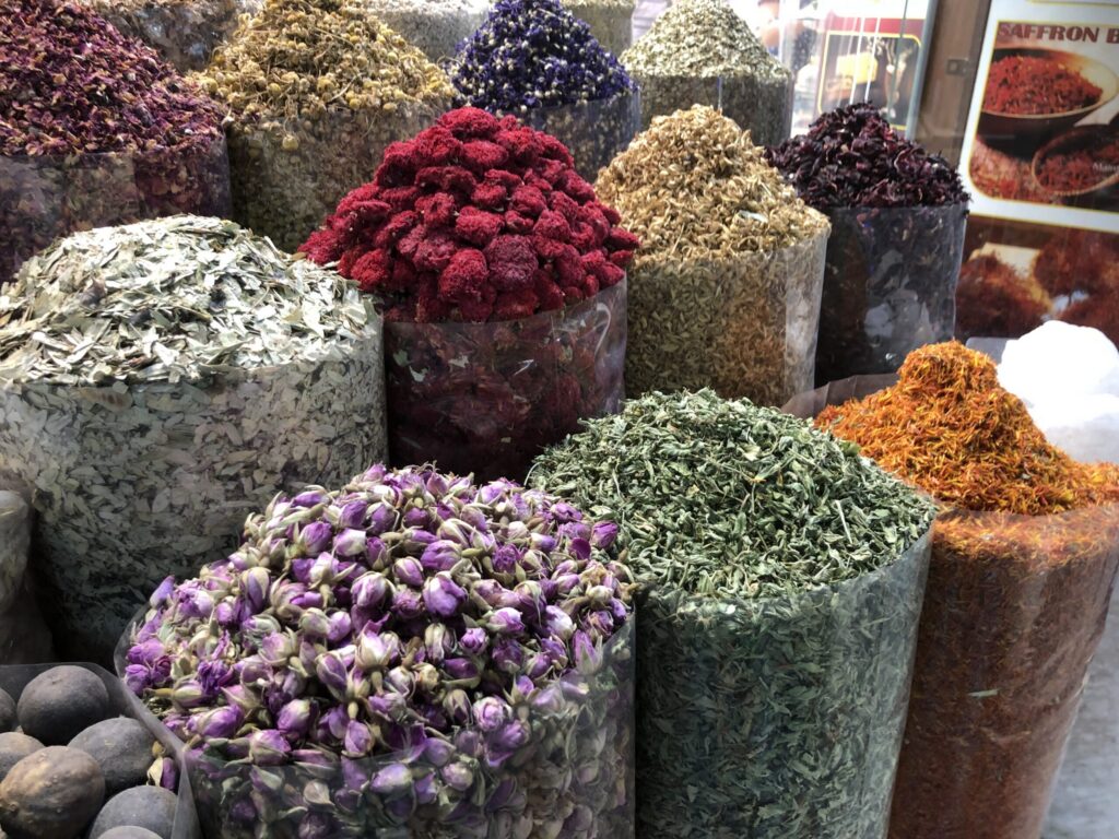 Colorful spice stalls at the Deira souk in old Dubai