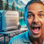 Smiling man with tickets in front of EcoFlow generator, forest and lake in the background, adventure and economy vibe.