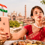 Caroline taking a selfie in a red sari in India