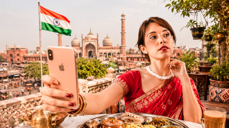 Caroline taking a selfie in a red sari in India
