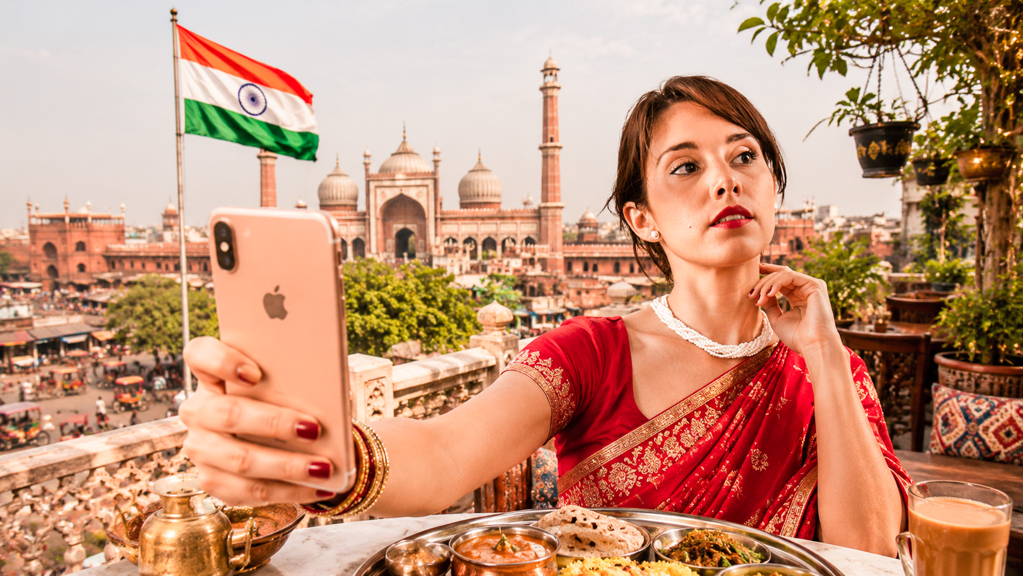 Caroline taking a selfie in a red sari in India
