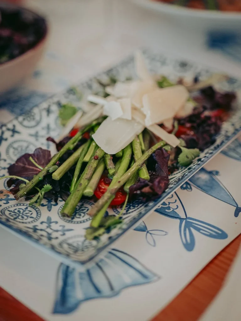 Salad of asparagus, cherry tomatoes, young leaves and cheese shavings at Nikita restaurant in Tavira, Algarve