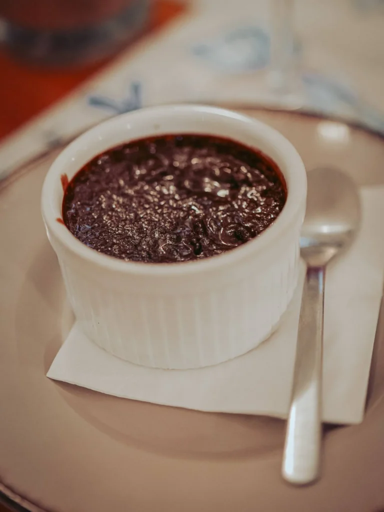 Ramekin of chocolate and orange mousse on a plate at Nikita restaurant in Tavira, Algarve