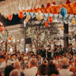 Night festival of São João in Tavira: paper decorations and folk group on stage