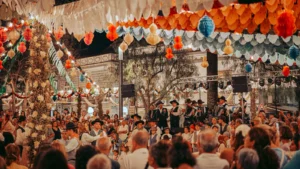 Night festival of São João in Tavira: paper decorations and folk group on stage