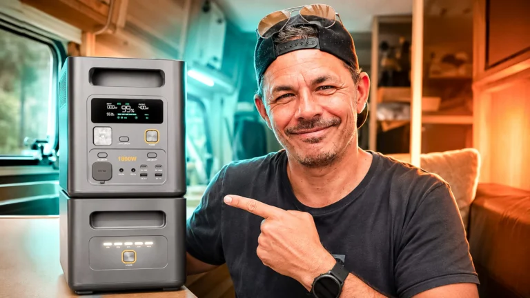 Xavier shows a stacked solar station with its extension battery in a van