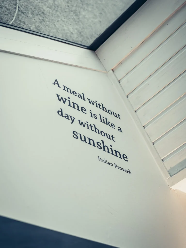 Wall quote in a room at the Allan Park Hotel in Stirling, Scotland, visible near a window in August 2026.