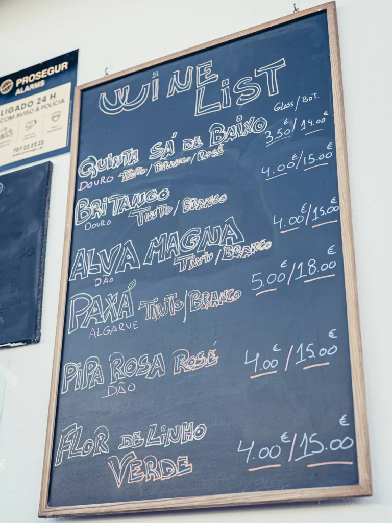 Wine List slate from Bodeguita Salinas in Tavira: selection of Portuguese wines by the glass and bottle, from Quinta Sá de Baixo (house wine) to Paxá from the Algarve.
