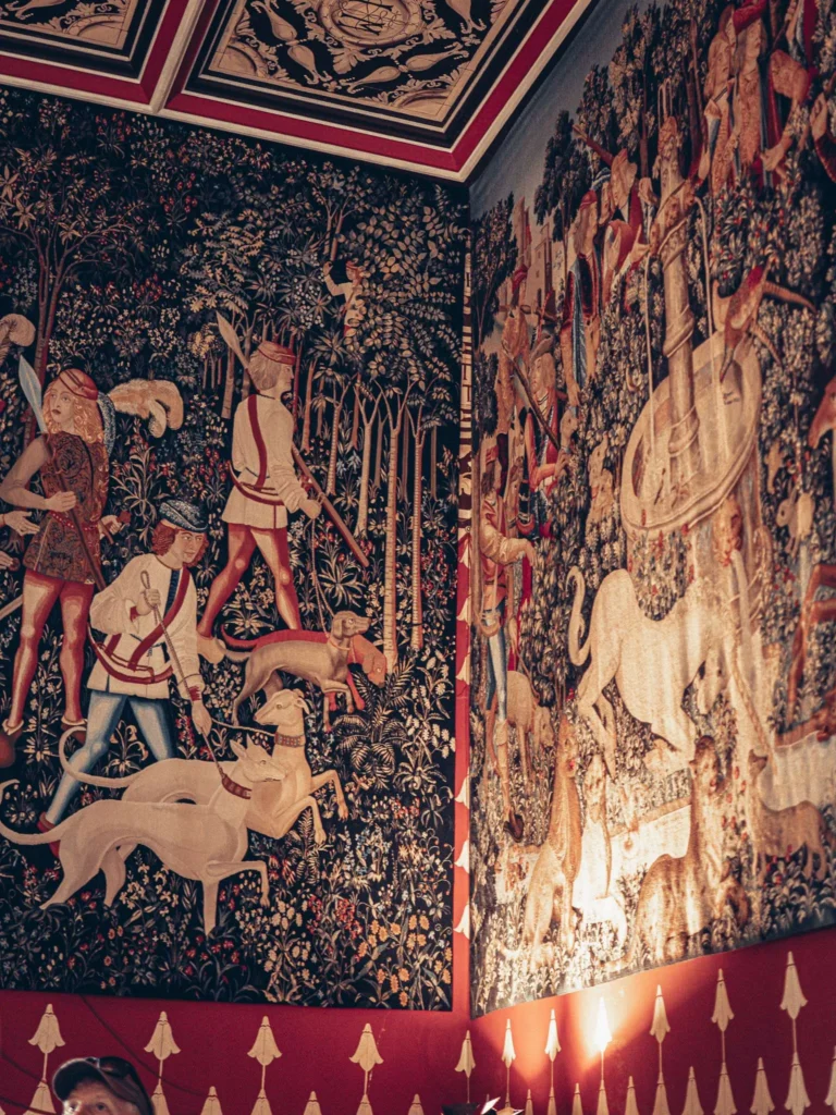 Richly woven tapestries showing hunting scenes and animals, on display in a room at Stirling Castle, Scotland.