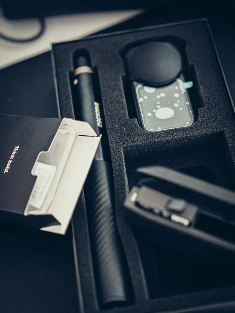 Insta360 X6 pack contents: camera, pole, charging case, and manual in protective foam
