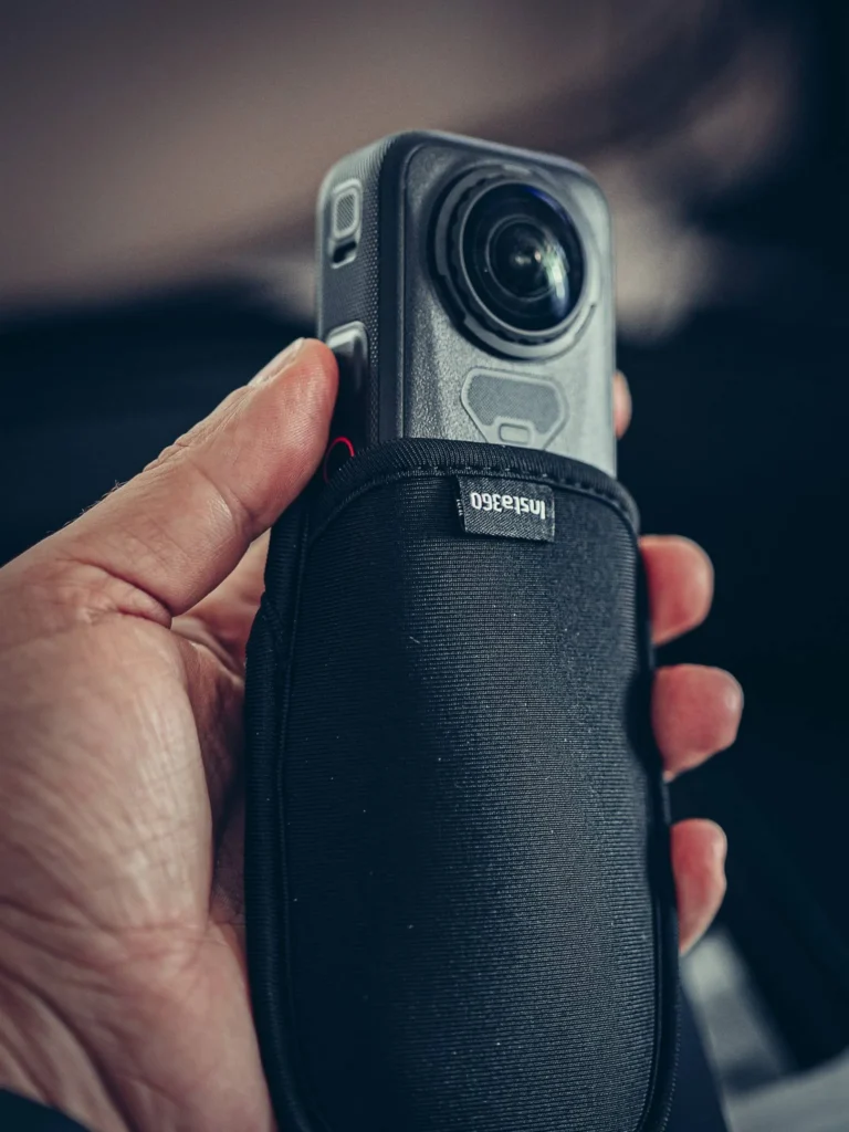 Insta360 X6 half out of its carrying case