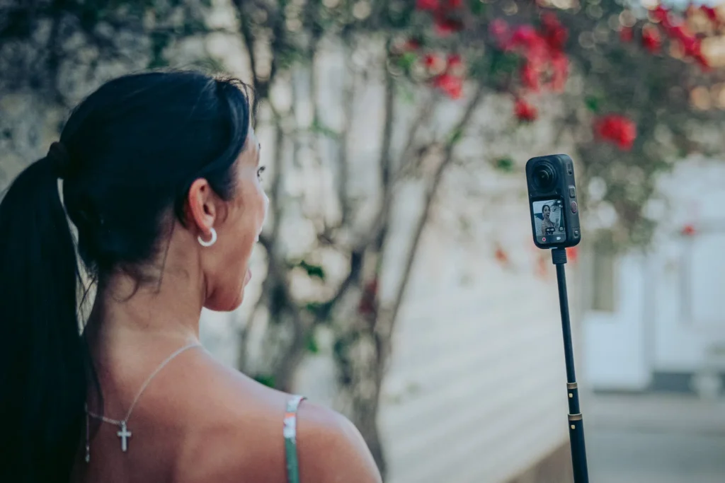 Insta360 X6 used outdoors on its selfie stick in the Algarve
