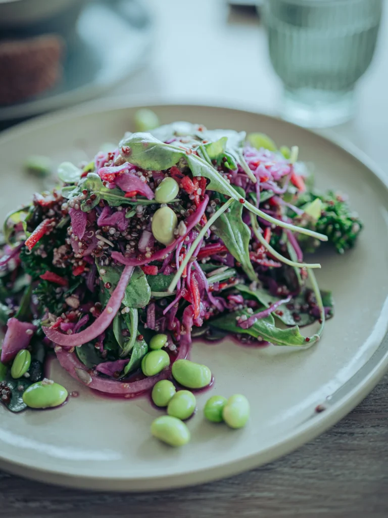 The Linnhe Salad, quinoa, broccoli, edamame, rocket, carrot, red cabbage and a sesame dressing, on a wooden table at the Linnhe Storehouse and Cafe at Portnacroish, Argyll.