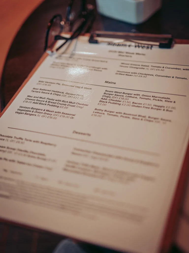 The Mid Week Menu at Roam West laid out on a wooden table in Inchree, Onich, between Glencoe and Fort William.
