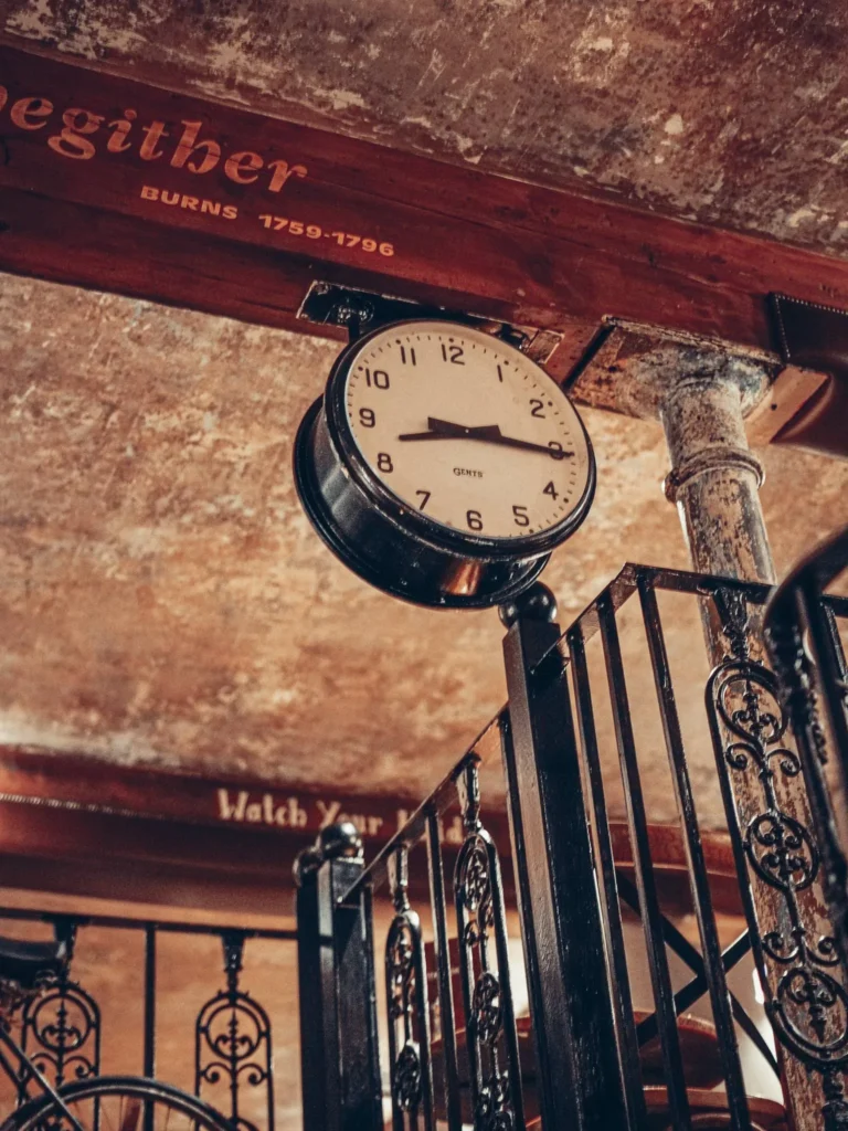 Antique clock fixed to a balustrade at Stravaigin, Glasgow, on one of the levels of the dining room.