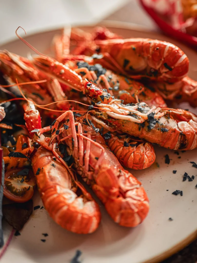 Grilled local langoustines served with herbs and seaweed flakes at The Geographer in Fort William.