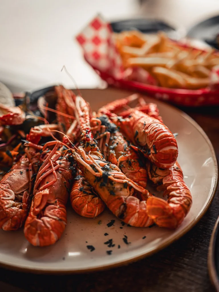 Grilled local langoustines served with fries at The Geographer in Fort William.