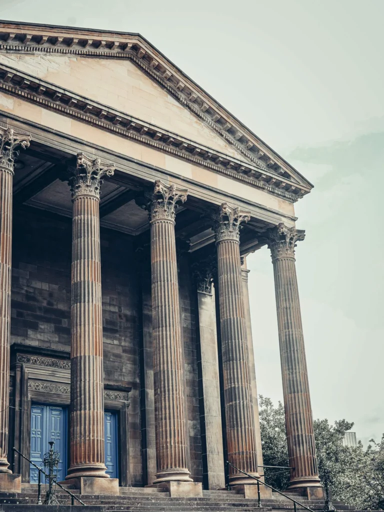 Monumental facade with columns and blue doors in the West End of Glasgow, near the university, on August 14, 2026.