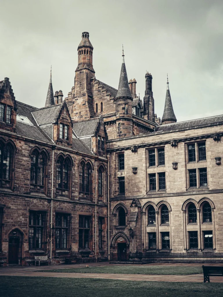 Gothic facade of the University of Glasgow, towers and arches, in the West End.