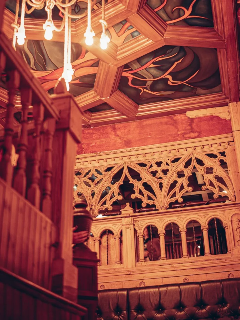 Reclaimed church joinery and a painted ceiling at Waxy O'Connor's pub in Glasgow.