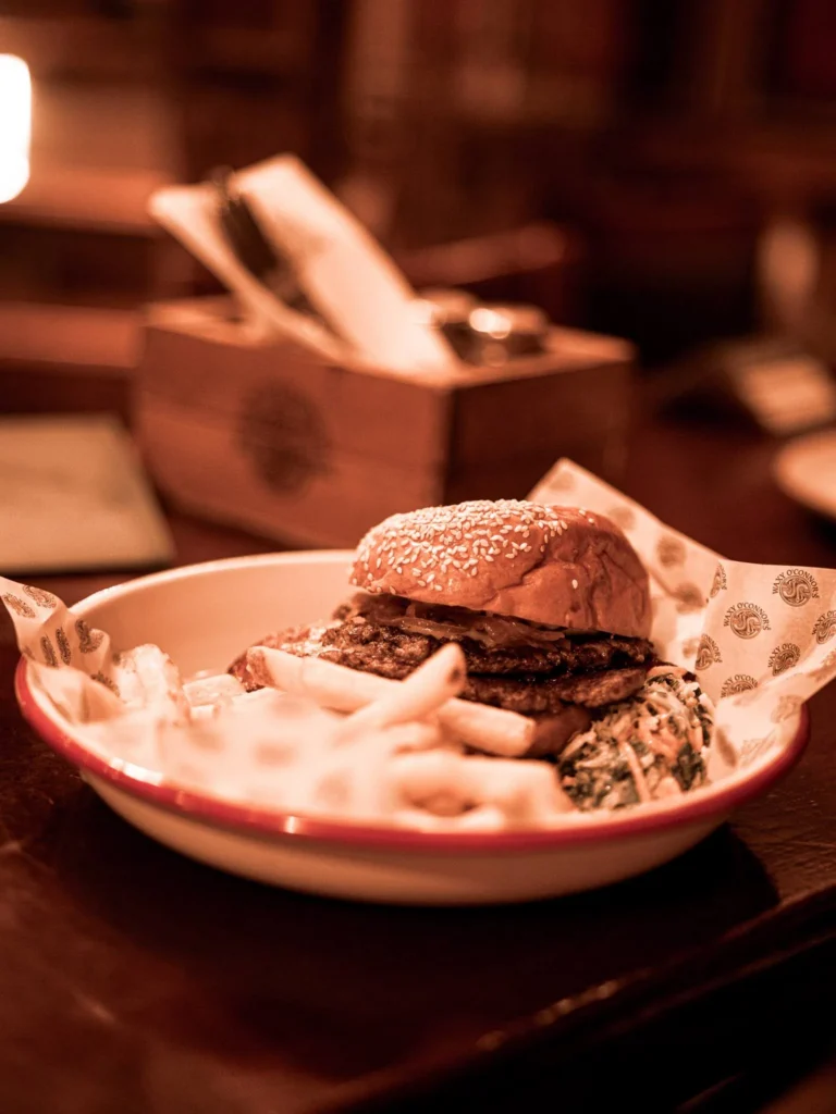 Bacon burger with chips and jalapeño slaw served at Waxy O'Connor's in Glasgow.