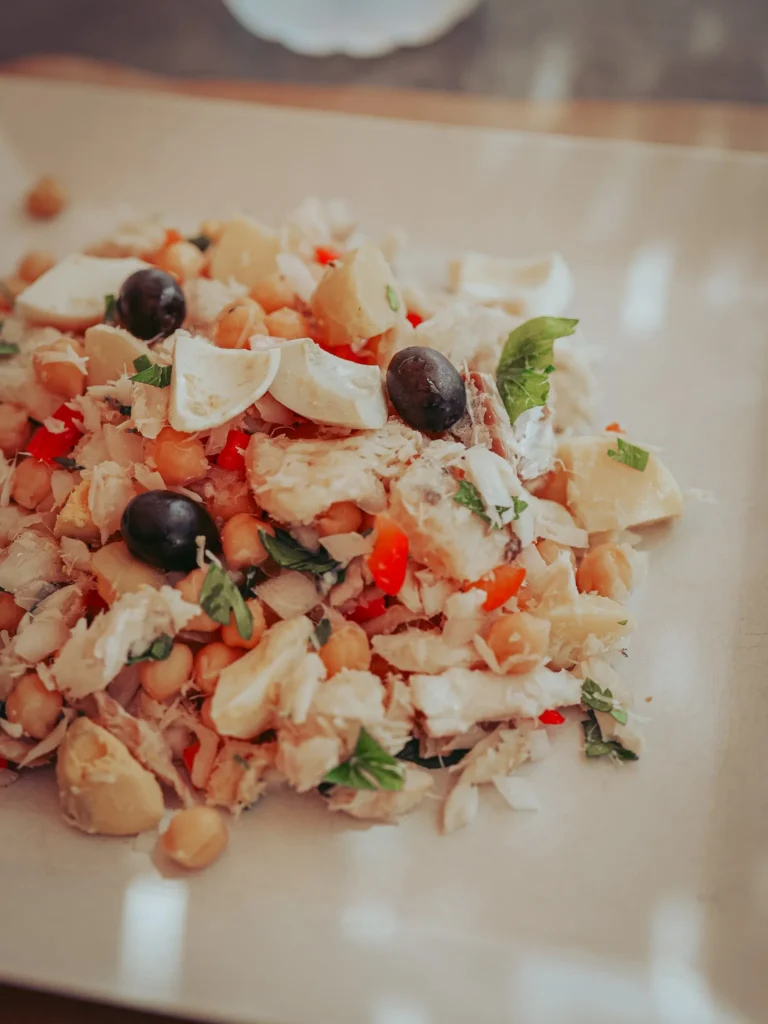 Portuguese salad plate made of chickpeas, cod, hard-boiled egg, black olives, and parsley, served at Machado restaurant in Tavira, Algarve, in early September.