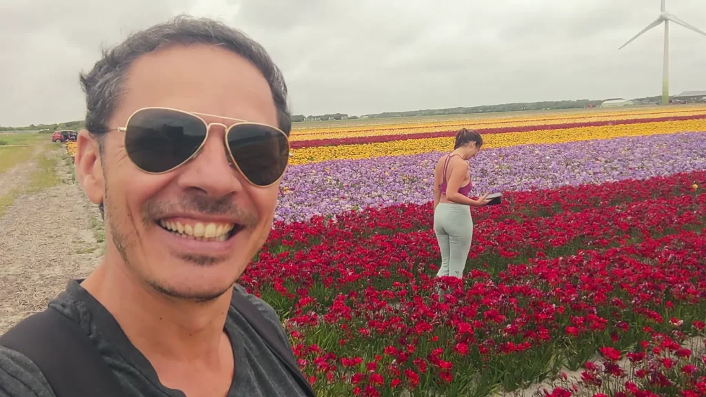 Xavier beside flowering fields on our coastal stop before Alkmaar