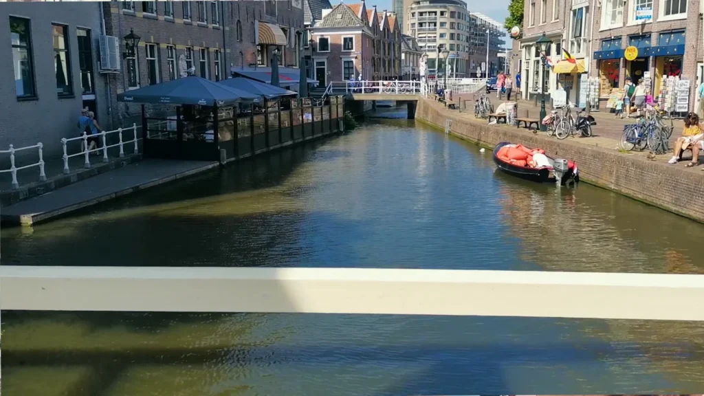 Canal, façades and a small boat in central Alkmaar
