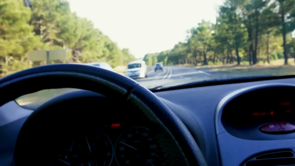 Caroline driving Suzan, the Peugeot 206 borrowed from her family near Arcachon