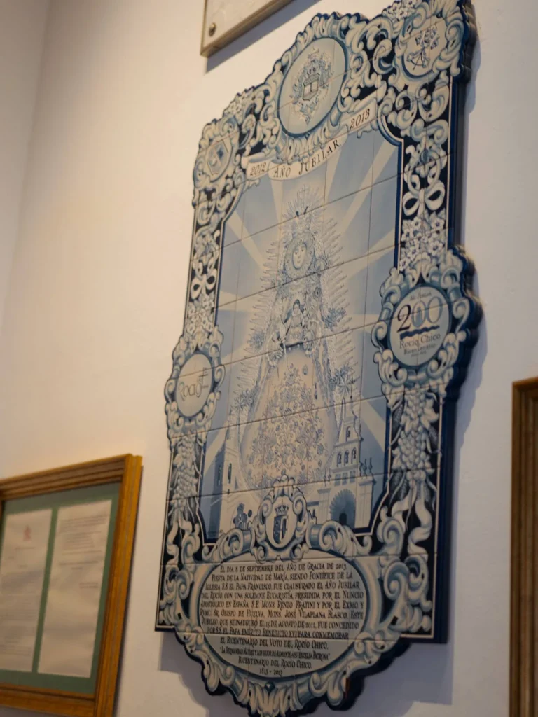 Blue ceramic panel commemorating the Rocío Chico bicentenary, 1813–2013, in El Rocío sanctuary